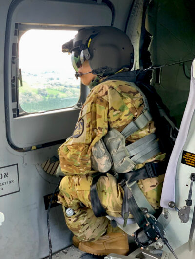 Fondy, dressed in all camo and a flight helmet.