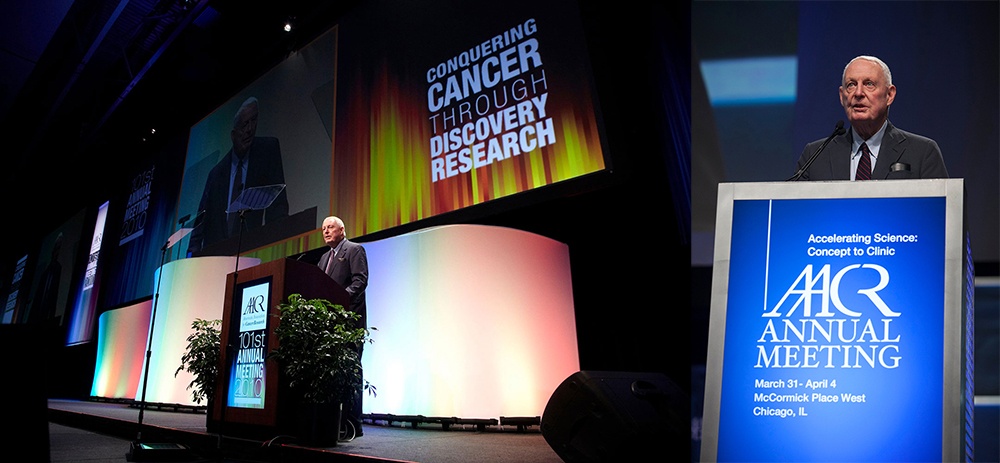 Clarkson speaking at an AACR annual meeting