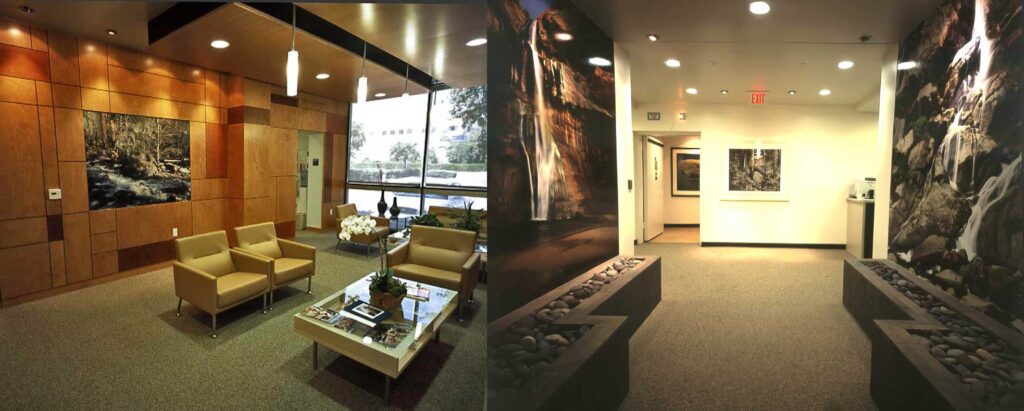 A doctor's office lobby with large landscape photos on the wall, as well as a hallway with floor-to-ceiling prints of waterfalls.