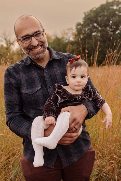 Abdallah holds Nadia in his arms.