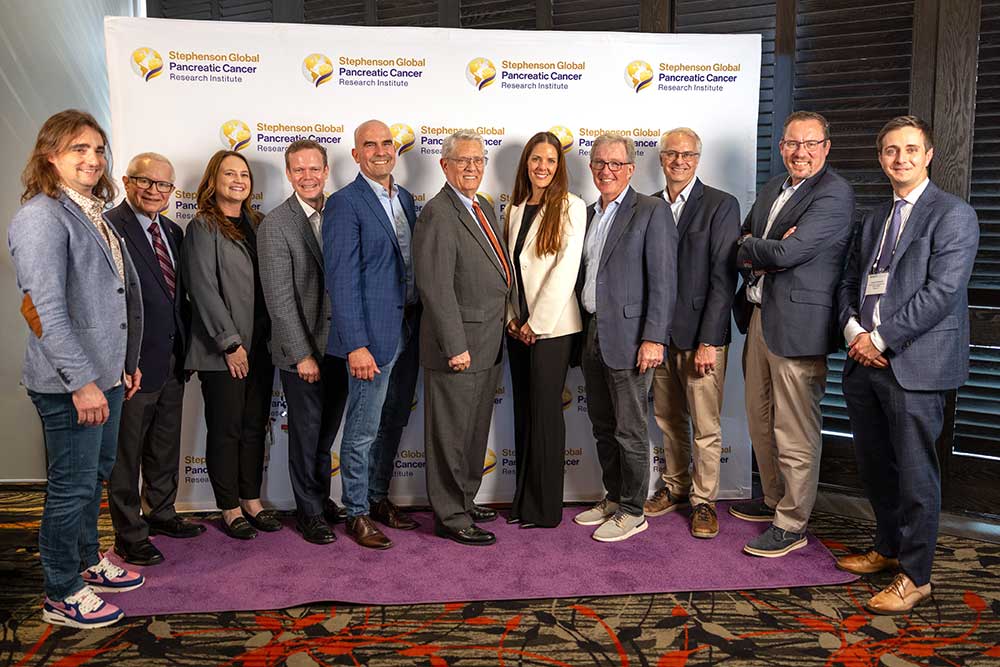 A group of pancreatic cancer researchers and advocates pose together at the symposium.
