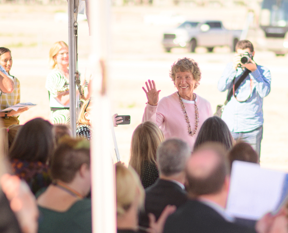 Karen Haight Huntsman waves to a gathered crowd.