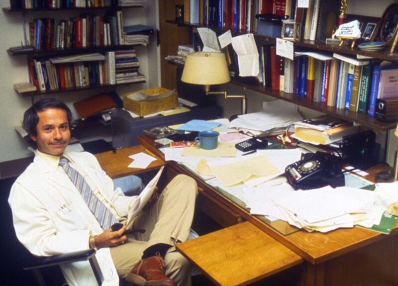 Vintage photograph of Morrow, rotary phone and old calculator on the desk.